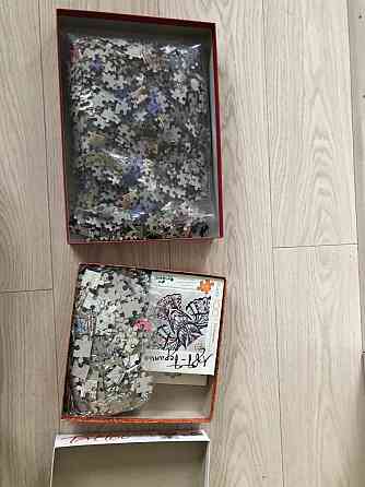 Две коробки пазлов 